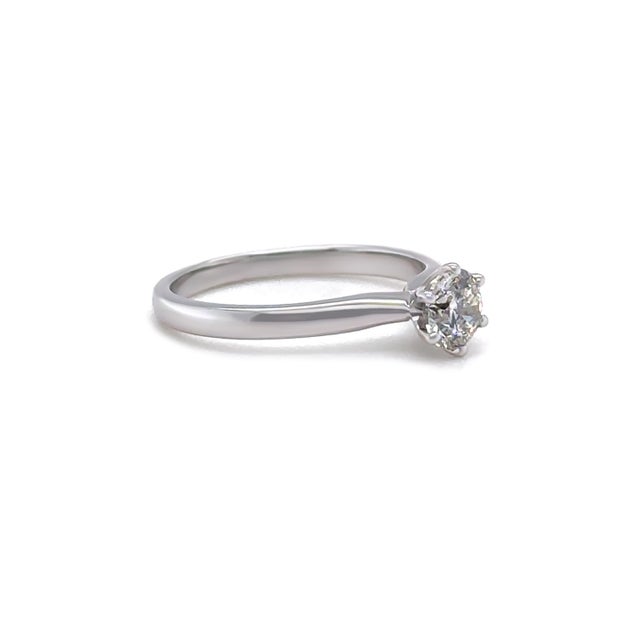 A timeless diamond ring crafted in 18ct white gold, featuring a round brilliant cut diamond secured in a classic claw...