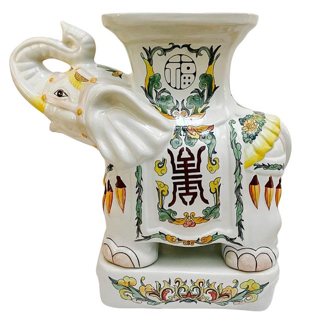 This striking pair of Hollywood Regency-style elephant garden stools brings an air of sophisticated whimsy and "more is...