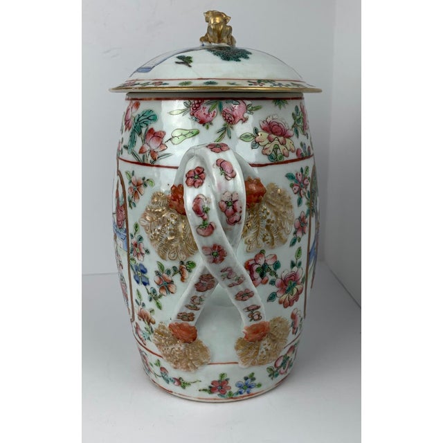 Antique Chinese Export famille rose porcelain cider jug with double or cross strap handles. There are court scenes in the...