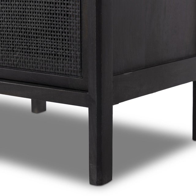 Black-finished mango frames inset black woven cane, for a textural, monochromatic look.
