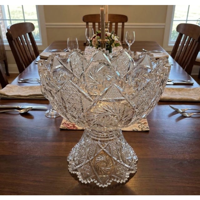 Striking oversized cut crystal pedestal punch bowl by Maple City Glass, featuring intricate American Brilliant–style...