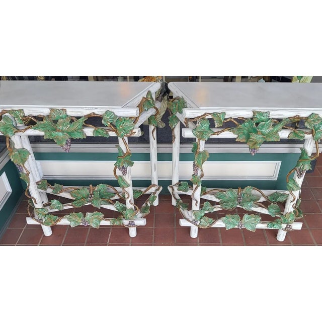 Both are in near fine condition. Their might be a chip or two to the leaves. The slate tops are in fine condition....