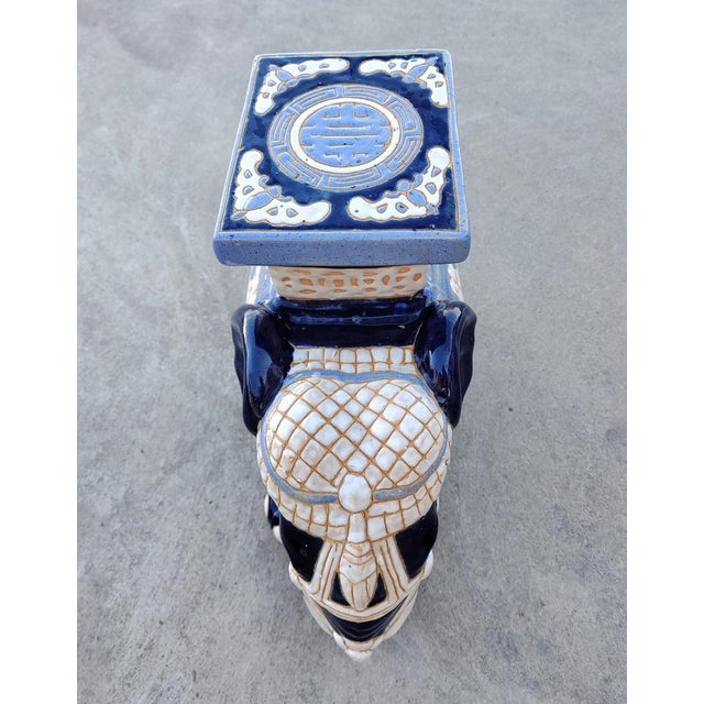 In this listing you will find a large ceramic and very decorative garden stool or plant stand in the shape of an elephant...