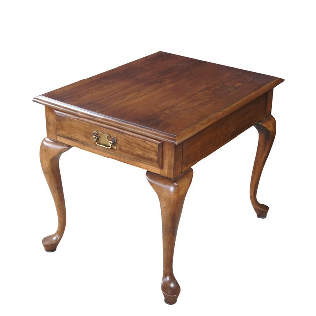 1980s Pennsylvania House Side Table. Features a solid cherry frame with one dovetailed drawer and colonial brass hardware....