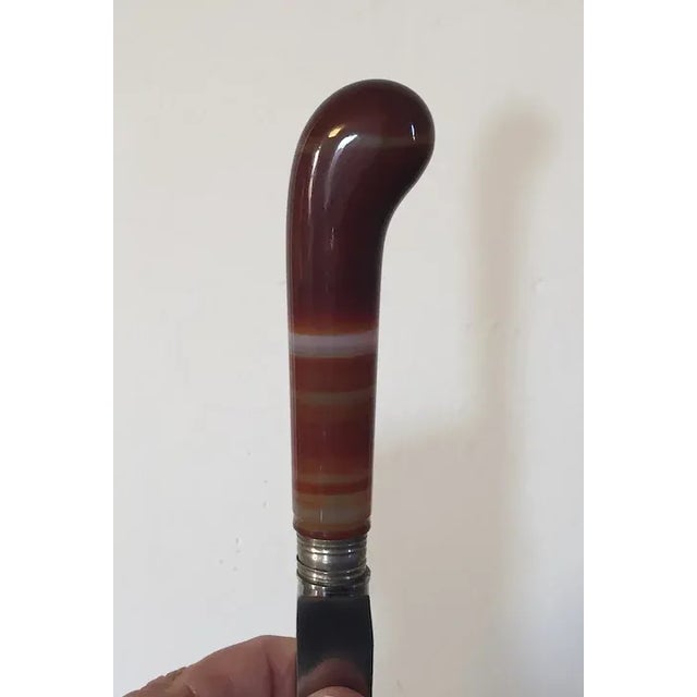 Pair antique English 19th century pistol handled knives with specimen agate handles and steel blades. Each measures 10"...