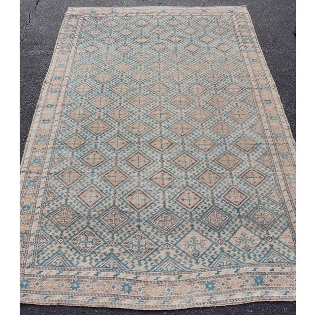 Measures: 4'8 x 8'1 Antique Persian Tribal Kurdish Rug with Light Blue Field and Geometric Design. Keivan Woven Arts/...