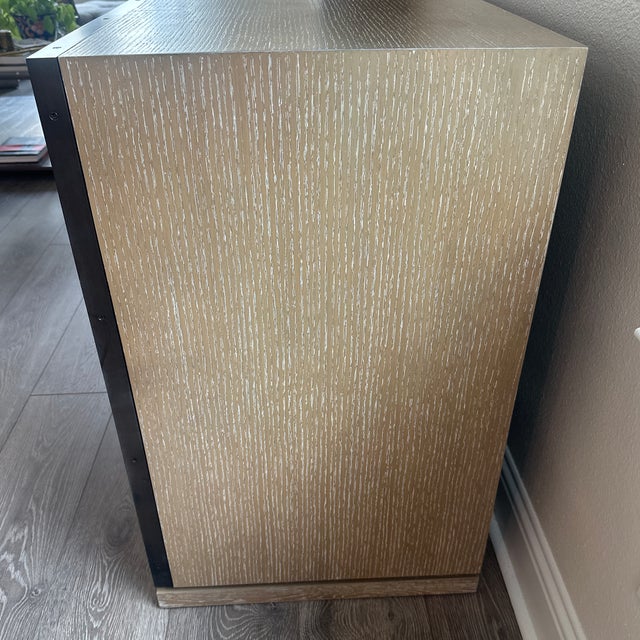 Stunning 3-door classic white linen cabinet with soft brass pulls, bronze finished door frames and American white oak...