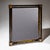 Charming rectangular Biedermeier mirror with an ebonized wooden frame featuring a pronounced concave molding and square...