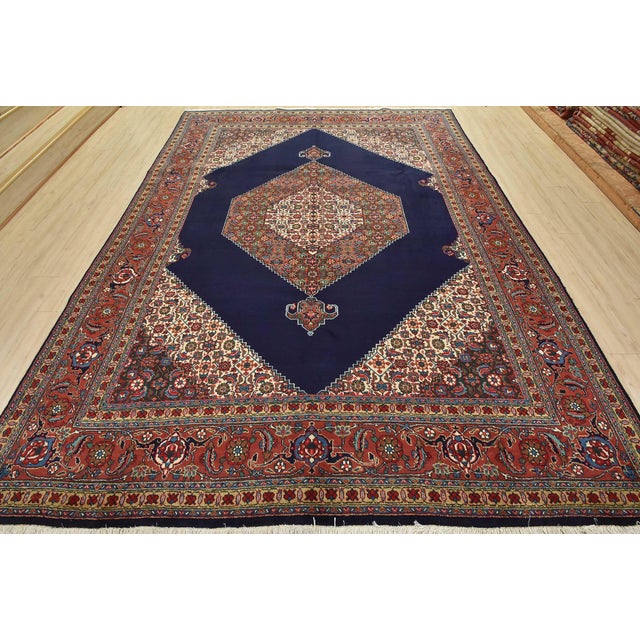 An authentic vintage traditional Tabriz rug hand-knotted with fine wool and natural dyes. This oriental rug features a...