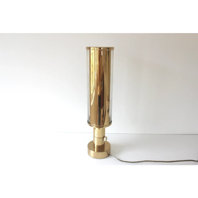 This lamp is absolutely stunning and very unique. It is Art Deco style with a substantial brass base. The top and back are...