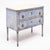 Italian chest with striking hand-painted design in cream and blue tones, supported by four fluted and tapered legs. The...
