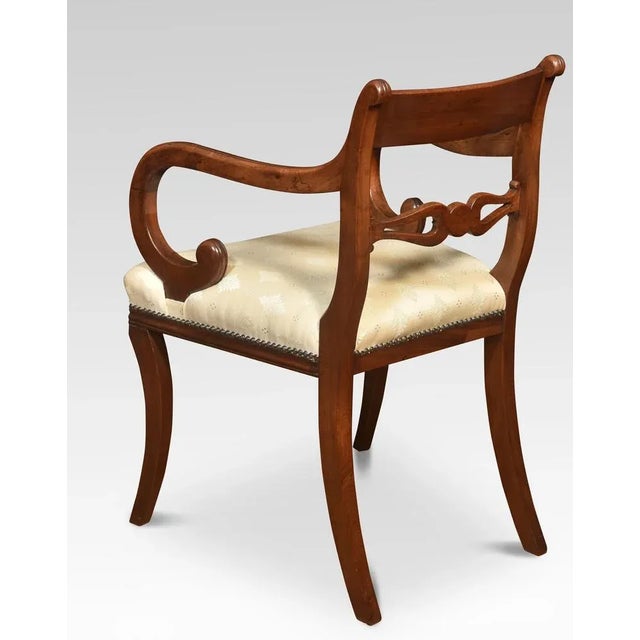 Pair of mahogany Carver Armchairs, The brass inlaid top rail above carved rail. To the upholstered seats, flanked by down-...