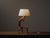 Tripod table lamp crafted from solid olive wood, made in Provence in the 1970s. Sculpted directly from branches, it...