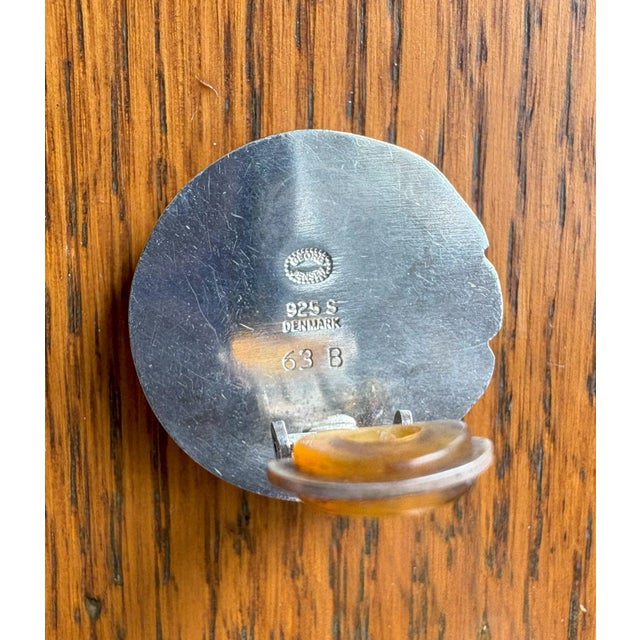 Georg Jensen vintage sterling silver earrings in a stylized fish style. The approximately 1-inch diameter earrings are...