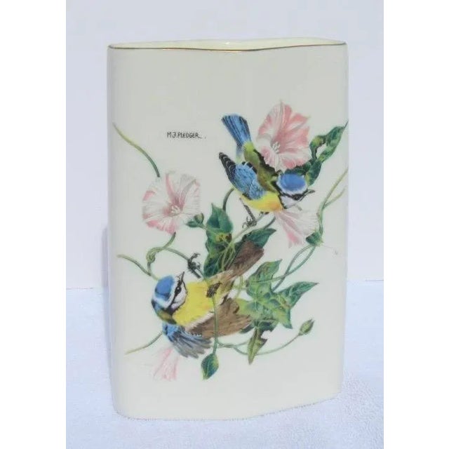 Mid-century Japanese porcelain flower vase in a diamond-shaped form. Floral spray with two blue jays play in the leaves....