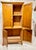 Handmade late 20th-century solid knotty pine cabinet featuring four paneled doors, farmhouse styling, and abundant...