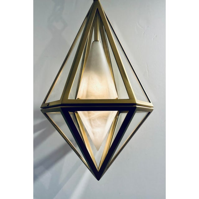 Original retail $7947, stylish Baltic Modern Alabaster and Satin Brass Geometric Lens Pendant Light, showroom floor...