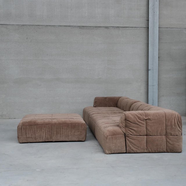 A large modular sofa by cini boeri for arflex. italy, c1970s. 'strips' model. two main elements with an ottoman, which can...