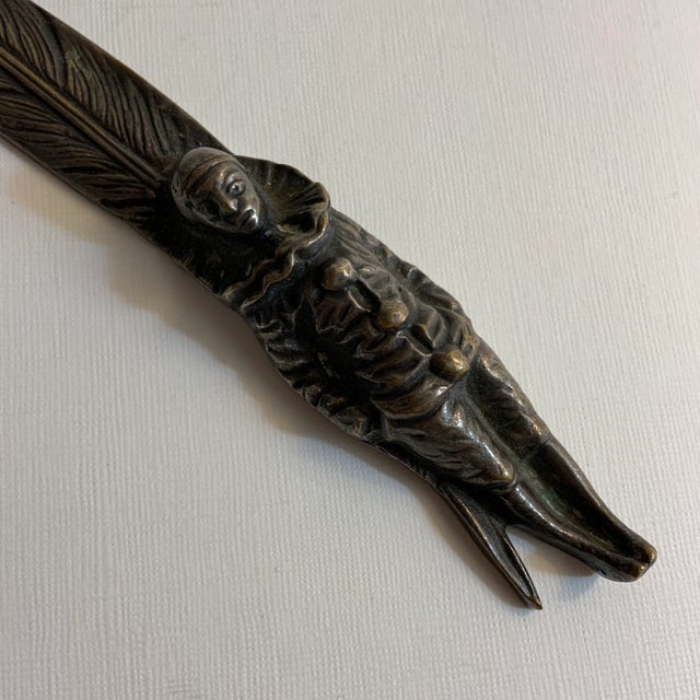 Marked Peerage England on back. Brass Pierrot or Clown figure with feather.