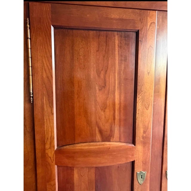 Quality Henredon solid cherry wood armoire. One owner in a smoke free home. Simple modern/ mid century style with a...