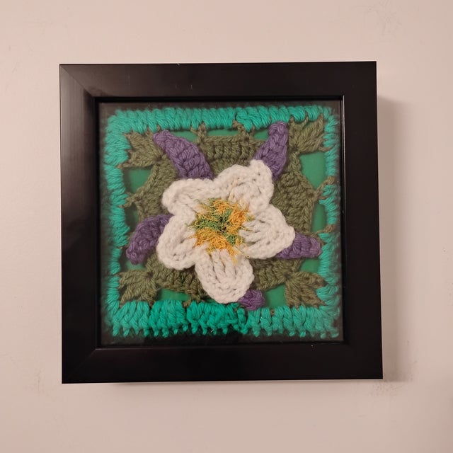 Crocheted white and lavender flower with green depicting stem and leaves. The Columbine, the state flower of Colorado....