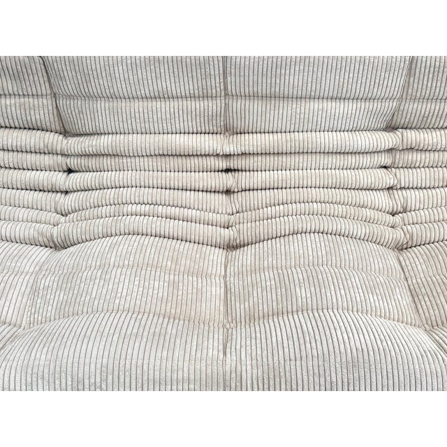 This Togo has been reupholstered with new foam and leather, preserving its shape & iconic looks.The bottom could show some...