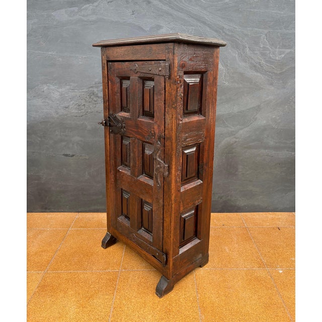Charming Spanish rustic cabinet crafted in solid oak, dating to the late 19th century. The exterior features a deeply...