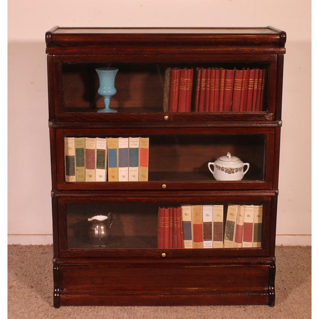 Elegant Globe Wernicke London mahogany bookcase from the late 19th/early 20th century, England, comprising three sections....