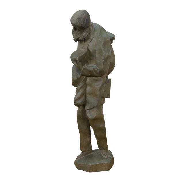 Vintage 20th century gray washed hand carved figurine in the shape of a sad barefoot traveler / hobo with wind tossed...