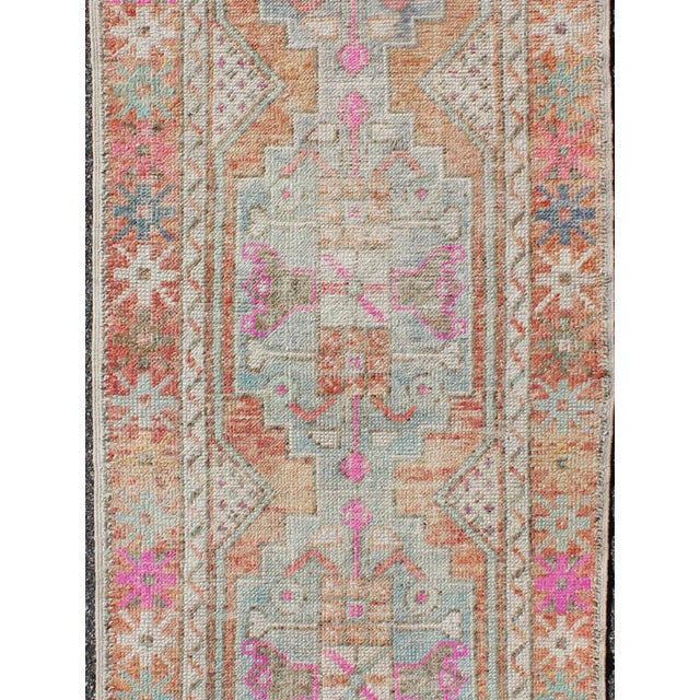 Oushak vintage rug from Turkey with multicolored Medallion design, colors include Orange, Purple/lavender, pink, green,...