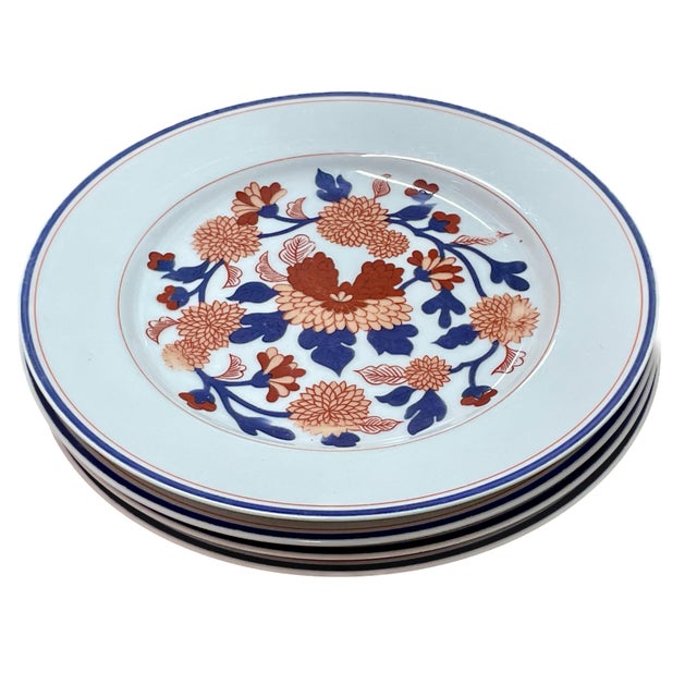 This stunning set of four vintage plates by Fitz and Floyd, dated 1975 (MCMLXXV) features a vibrant, stylized floral motif...