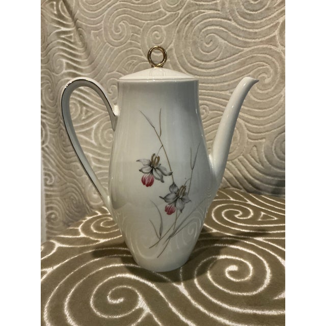 Elegant vintage porcelain coffee pot by Bareuther Waldsassen, crafted in Bavaria, Germany. This graceful mid-century piece...