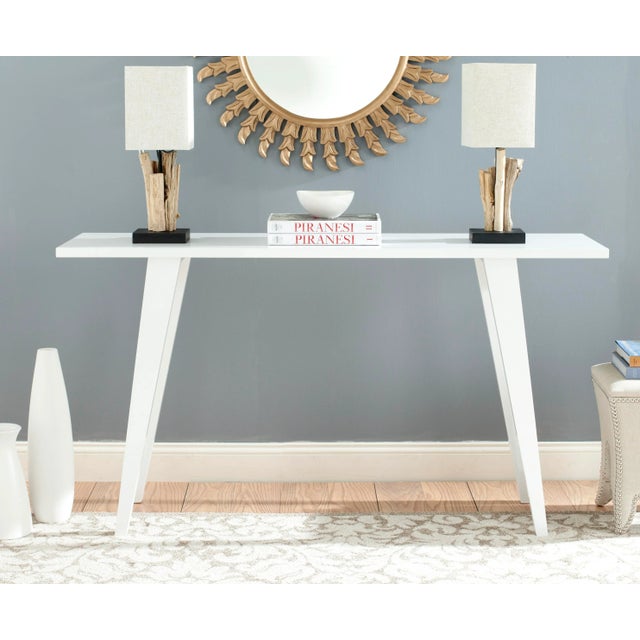 A modern interpretation of the centuries-old refectory table, this sophisticated white lacquer console table alludes to...