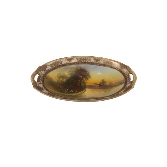 A finely detailed antique Japanese porcelain plate by Morimura Brothers, produced during the Nippon export period circa...
