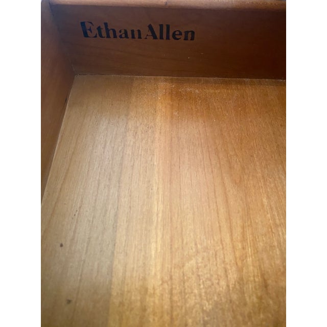 Late 20th Century Ethan Allen Georgian Court Cherry Night Table. Measuring 24 inches wide, 18 inches deep, and 26 inches...