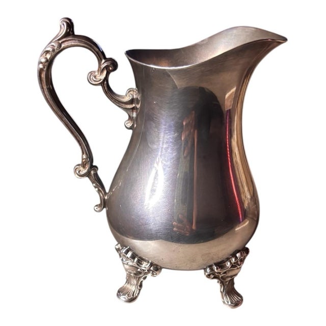A beautifully detailed vintage Gorham silverplate tea and coffee service set featuring elegant curves, ornate handles,...