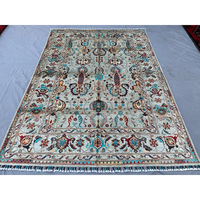 This hand-knotted Sultanabad rug is woven from hand-spun Ghazni wool on a cotton foundation, featuring an all-over...
