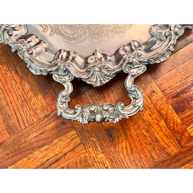 Heavy silver plate. Serving tray: 29" long x 19.5" wide. Marked: REED & BARTON Marks: 006115 D7 24