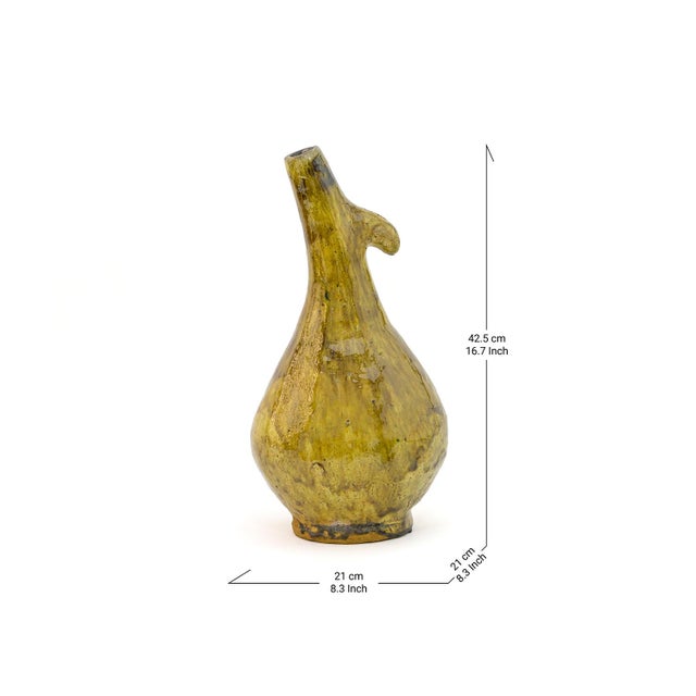 Tamegroute Amber Glazed Ceramic Pitcher Vase | Slender Neck, Bulbous Base | 16.7"H Description A slender, angled neck...