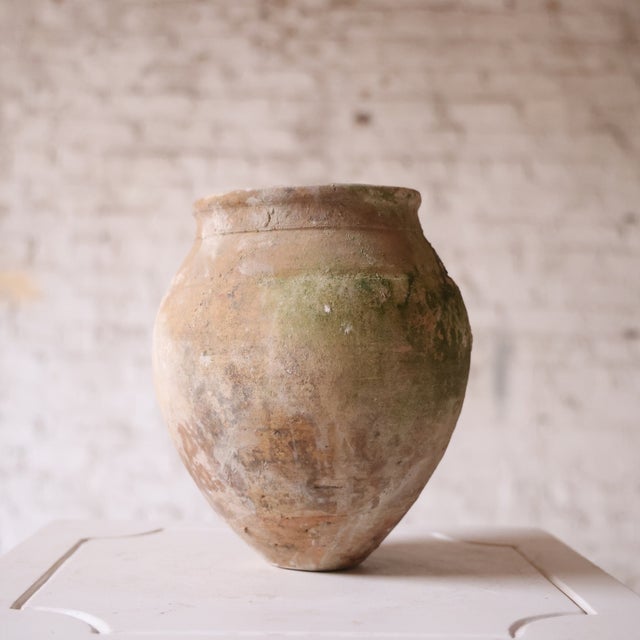 Add rustic Mediterranean charm to your space with this 20th century Spanish terracotta amphora, a beautifully handcrafted...