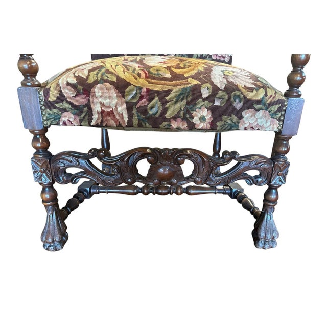 Beautiful late 19th century continental arm chair. It features carved, scrolled, down swept arms ending in carved...