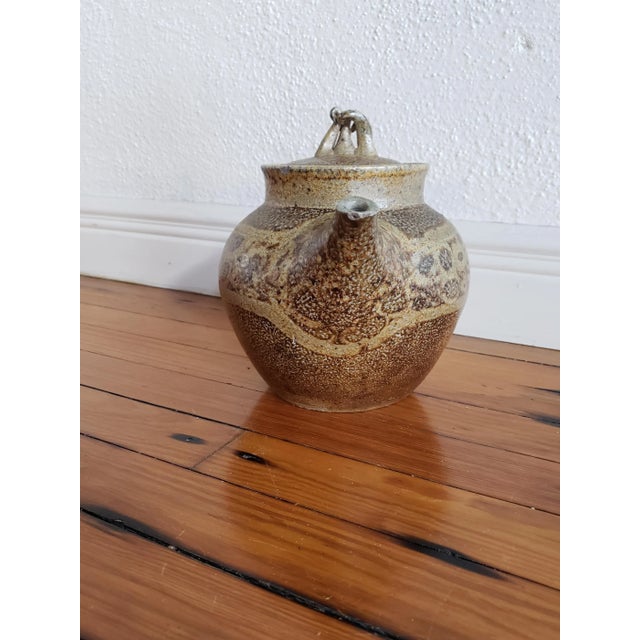 Unique and wonderfully crafted vintage Viola Frey attributed production pottery teapot. It is in good condition, with some...