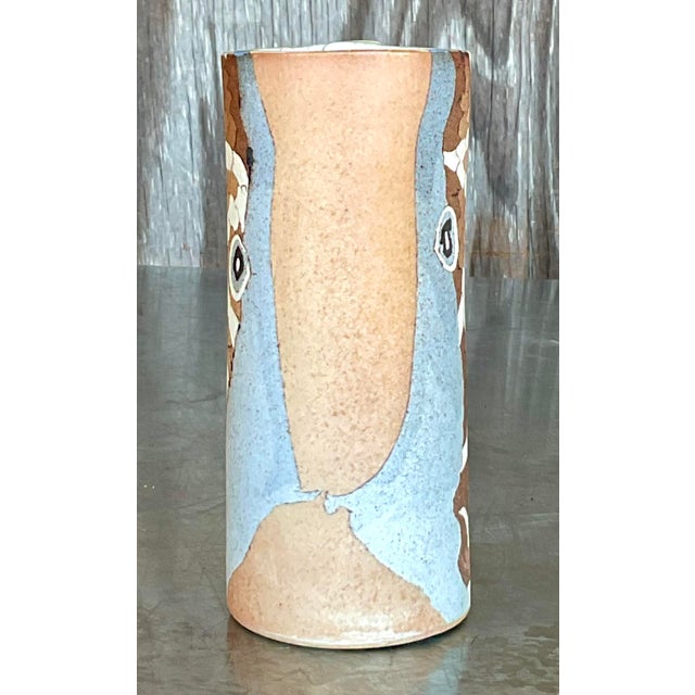 Add a touch of retro charm to your space with this Vintage Boho Slab Built Studio Pottery Vase. Its handcrafted design and...