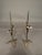 An unusual pair of early French wrought iron candelabras dating to circa 1850. Featuring a dark brown finish and a...
