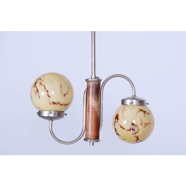 This chandelier is a rare and exceptionally elegant example of early Czechoslovak Art Deco from the 1920s. This style is...