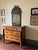 An exceptional early 19th-century Italian Empire cherrywood chest of drawers, masterfully crafted in Lucca (Tuscany)...