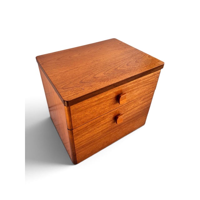 A refined teak chest of drawers designed by Ron Carter for Stag as part of the Cantata Collection, circa 1970. Featuring...