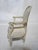 Child’s Armchair in the Style of Louis XVI White paint on wood with the natural color coming through to appear well-worn....
