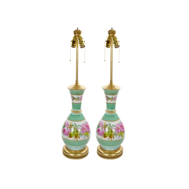 A beautiful pair of French Neoclassical Paris porcelain urns mounted as table lamps, dating to the early to mid-19th...