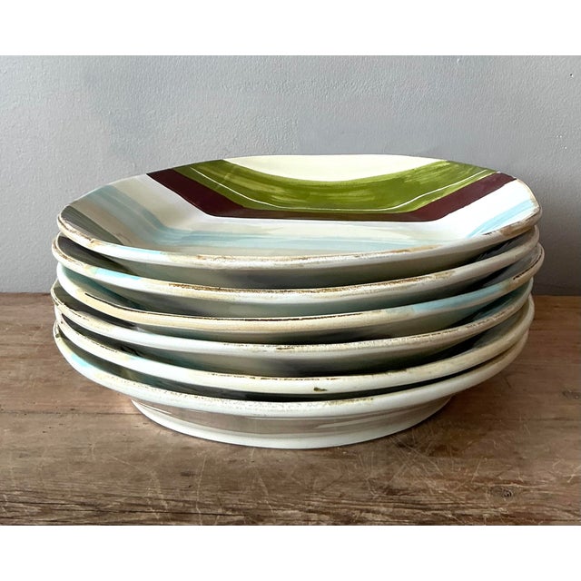 This vibrant set of six vintage dinner plates by the renowned house of Vietri is a stunning testament to Italian artisanal...